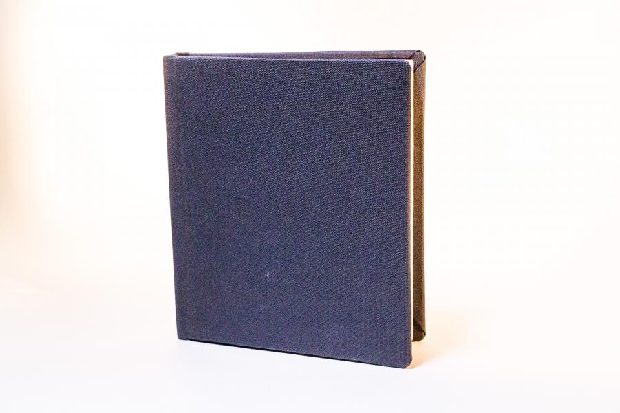 Closed navy blue book.