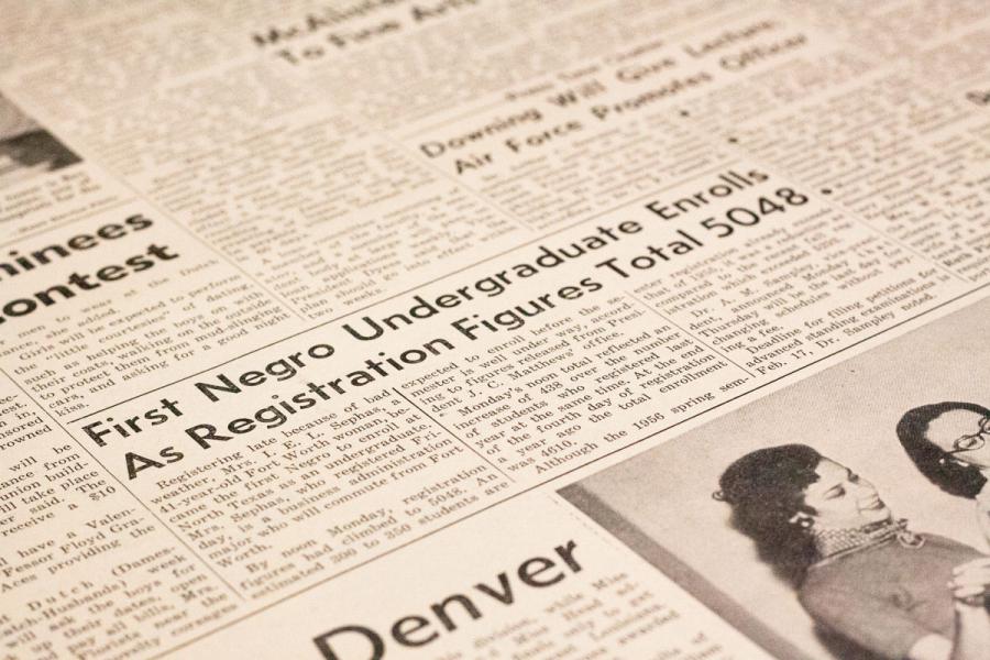 photograph of a section of newspaper at an angle. The main visible title reads First Negro Undergraduate Enrolls as registration figures total 5048