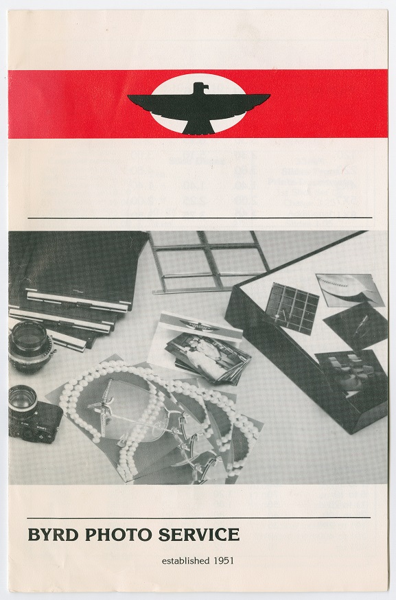 White brochure, a red banner at the top with a black eagle symbol on it. Below it is a photo of film items on a table, the title at the bottom.